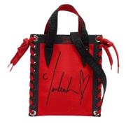 Christian Louboutin Pre-owned Pre-owned Canvas totevskor Red, Dam