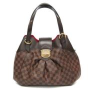 Louis Vuitton Vintage Pre-owned Tyg axelremsvskor Brown, Dam