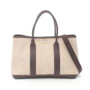 Hermès Vintage Pre-owned Canvas handvskor Beige, Dam