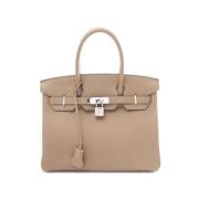 Hermès Vintage Pre-owned Laeder handvskor Beige, Dam