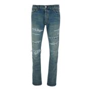 Amiri Blå Ripped Denim Jeans med Logo Patch Blue, Herr